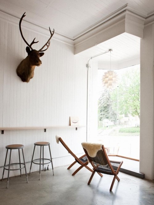 Crisp white Vergennes Laundry interior with Benjamin, the antique caribou in pride of place (image by Corey Hendrickson)